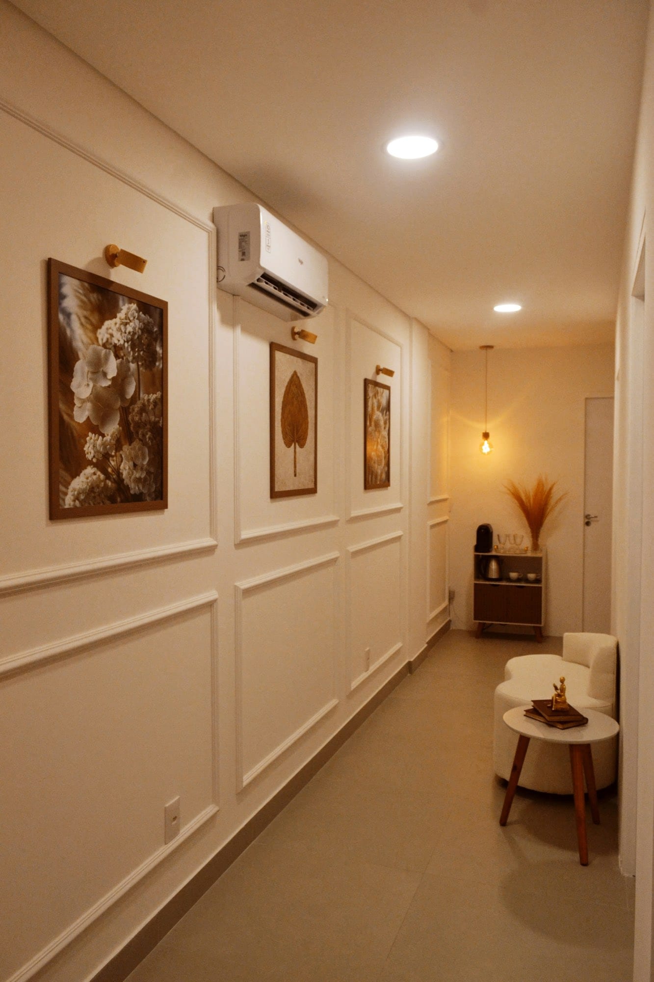 Warm, paneled hallway leading to a clinic’s seating nook