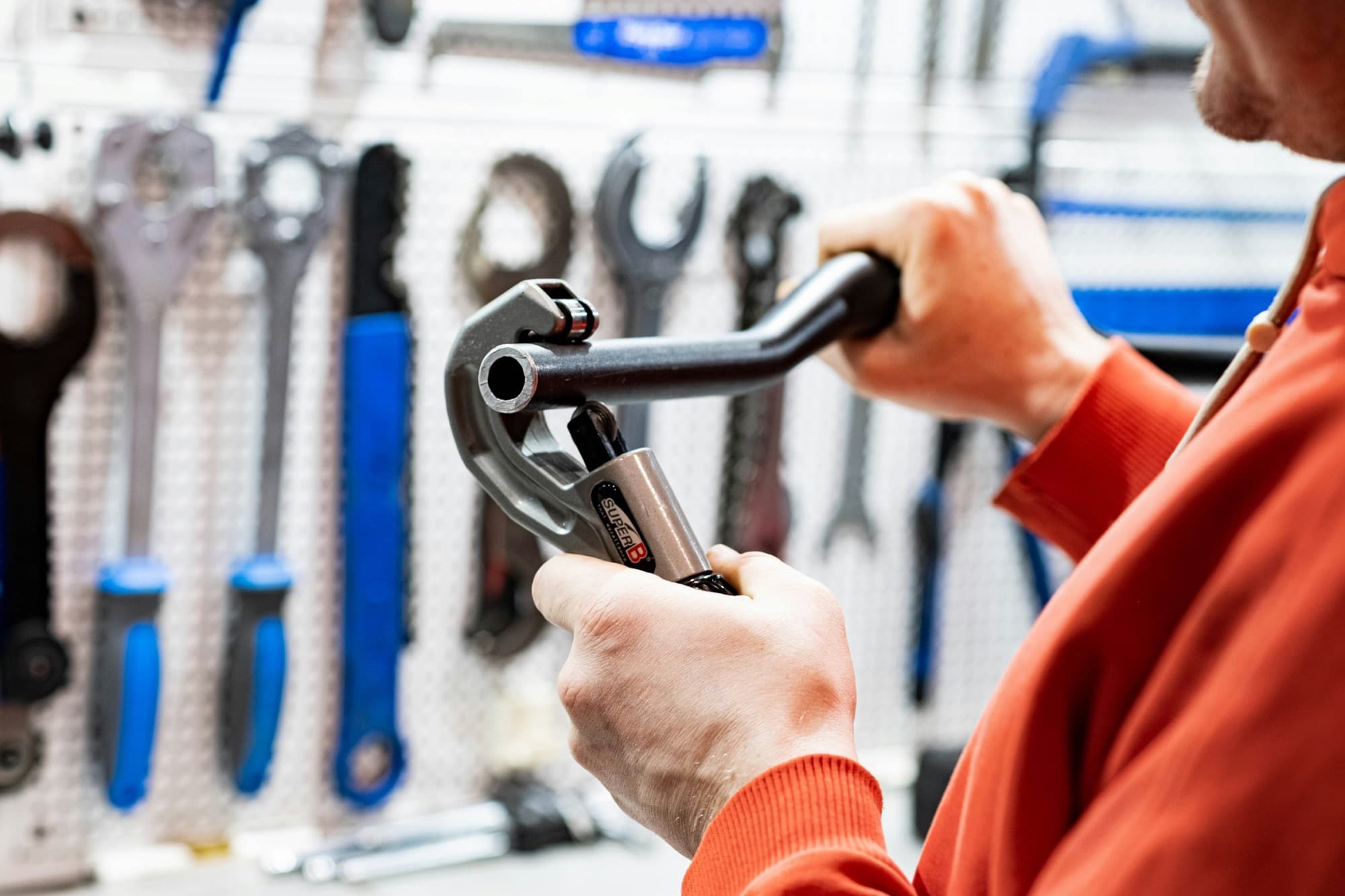 Plumber holding a pipe wrench, ready to work